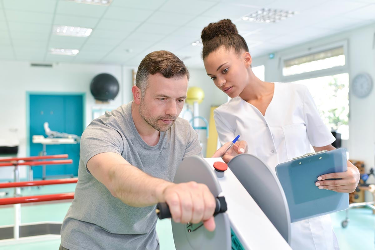 Occupational therapist assisting patient